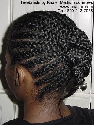Cornrows with ponytail, left side.